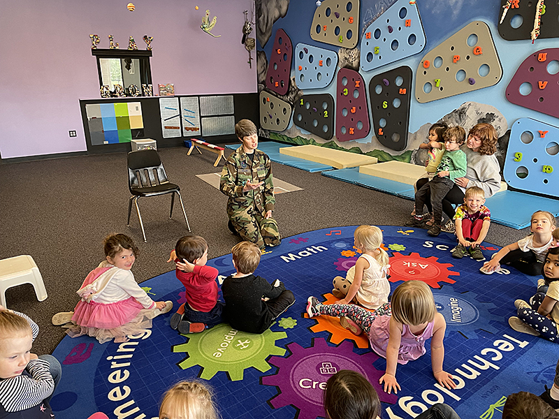 A U.S. Military Captain talks to FRCS preschoolers