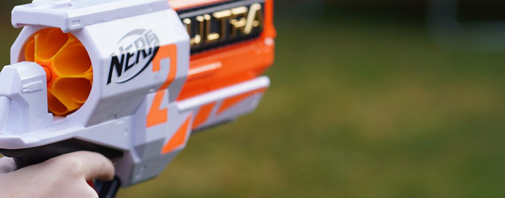 photo of a Nerf dart gun by Kolby Milton via unsplash